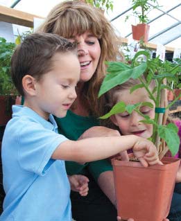 woman and child in green house