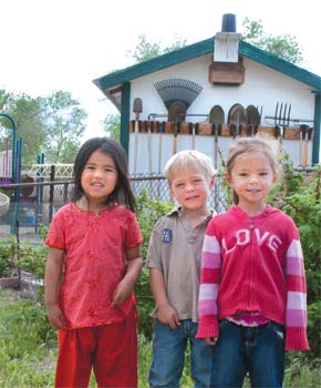 three children in a garden