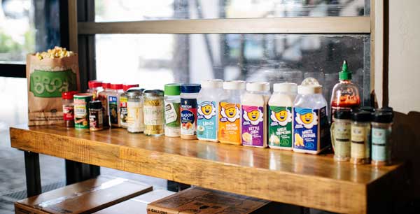 The spice bar offers a variety of popcorn seasonings, including the traditional salt, pepper, and real butter, as well as up to 20 other creative options