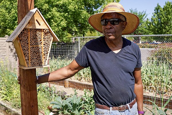 Earstin Whitten standing in his garden