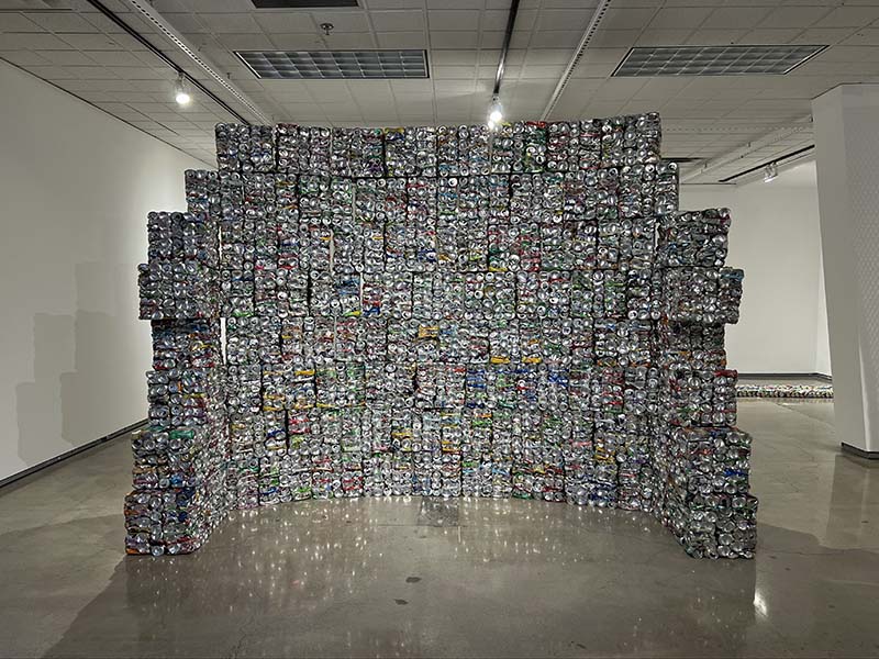 Fractionary Mass (2022) is 8 feet by 9 feet and built out of 12,000 condensed aluminum cans, which Karrasch says equate to 3.4 seconds of U.S. consumption