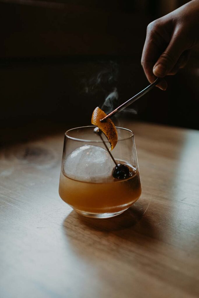 Smoked ice and orange peel scent a Yokohama old fashioned cocktail